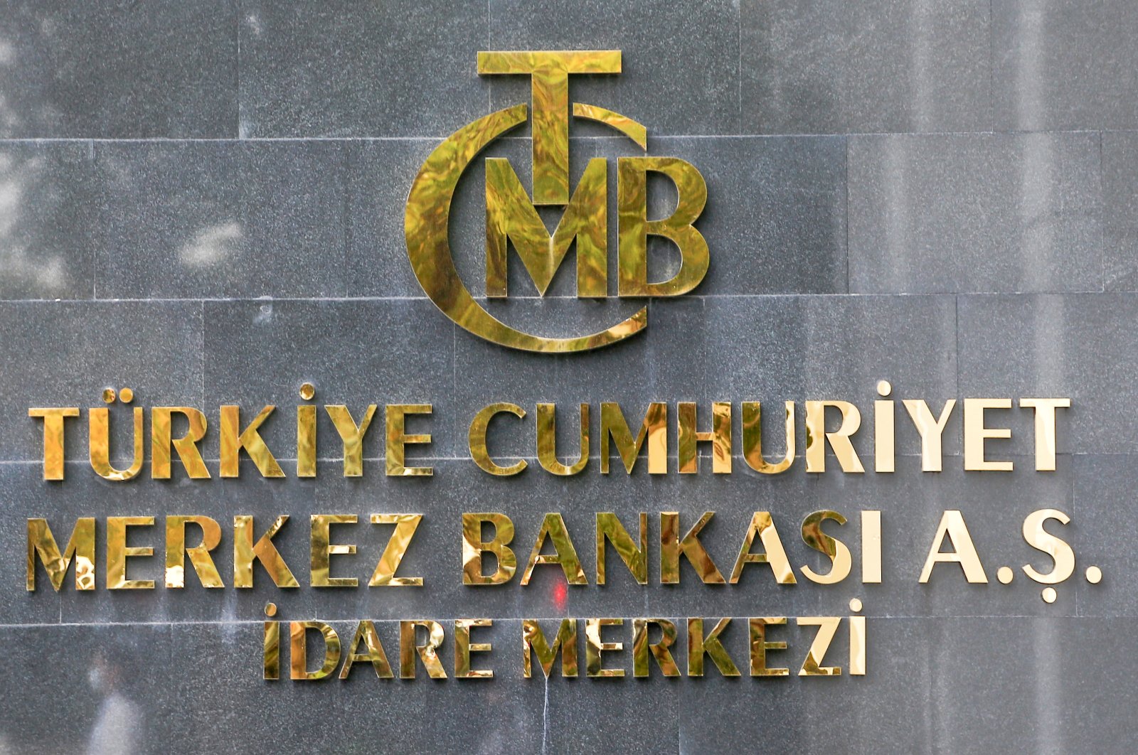 A logo of the Central Bank of the Republic of Turkey is pictured at the entrance of its headquarters in Ankara, Turkey, Oct. 15, 2021. (Reuters Photo)