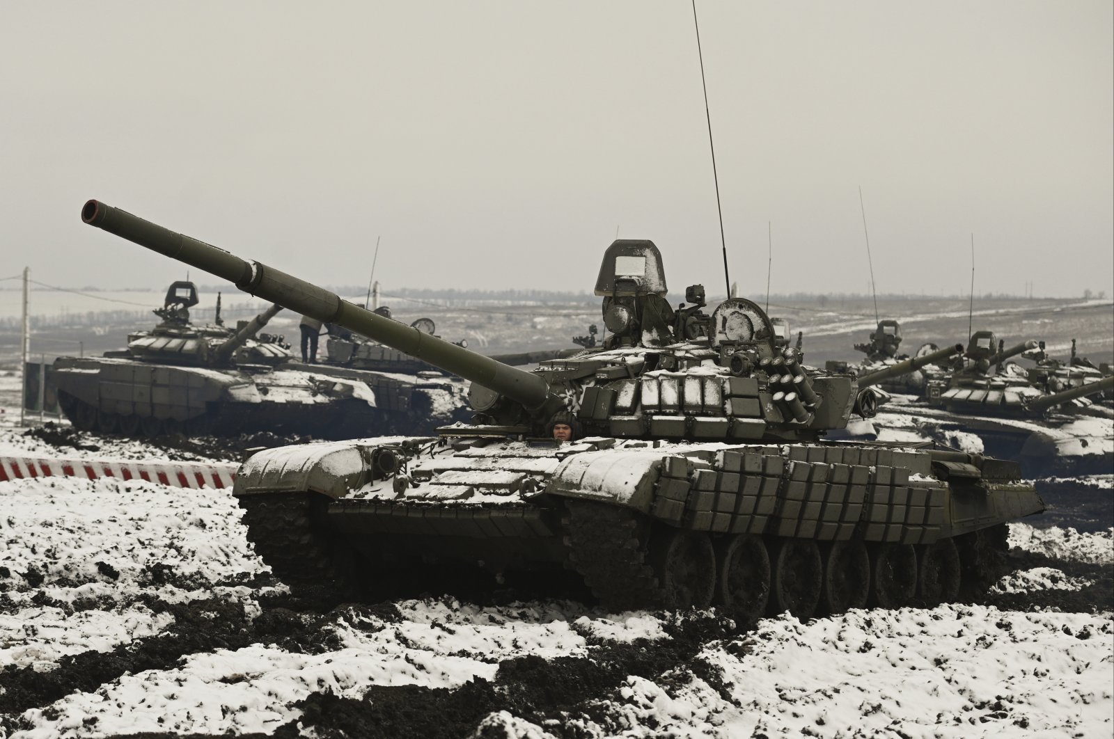Russian T-72B3 tanks take part in drills at the Kadamovskiy firing range in the Rostov region in southern Russia, Jan. 12, 2022. (AP Photo)