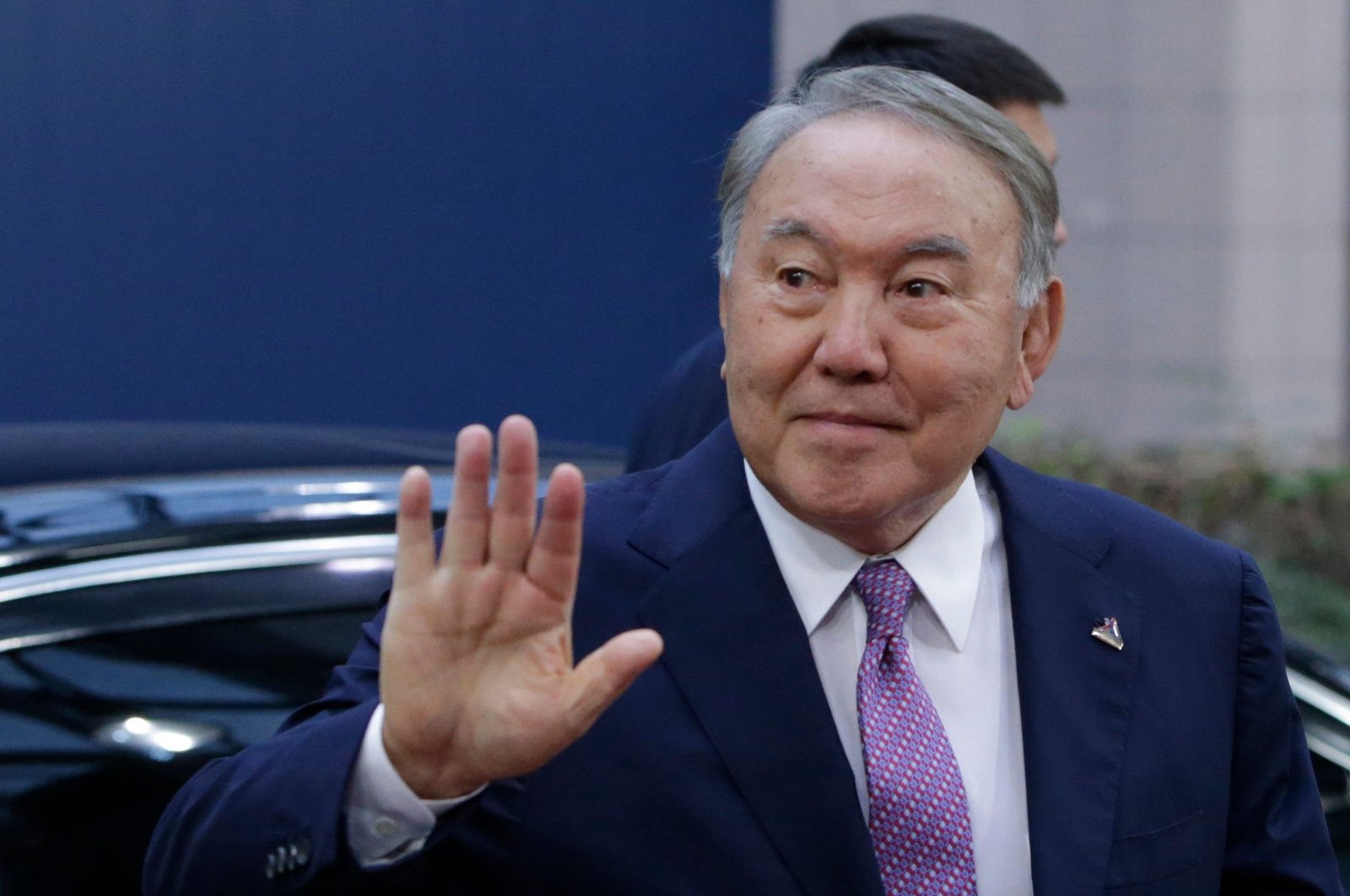 Kazakh President Nursultan Nazarbayev waves as he arrives for a Asia Europe Meeting (ASEM) at the European Council in Brussels, Belgium, Oct. 19, 2018. (AFP Photo)