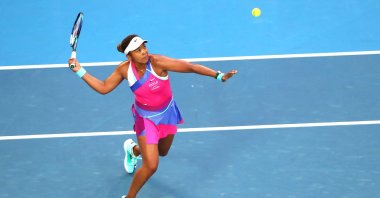 Japan's Naomi Osaka in action against U.S.' Madison Brengle in their Australian Open singles match, Melbourne, Australia, Jan. 19, 2022. (AFP Photo)