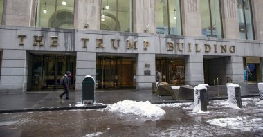 People walk by The Trump Building office building at 40 Wall Street in New York City, New York, U.S., Jan.  7, 2022. (AP Photo)