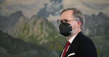 The Czech Republic's Prime Minister Petr Fiala walks to welcome European Council President Charles Michel for a meeting in Prague, Czech Republic, Jan. 13, 2022. (AP Photo)