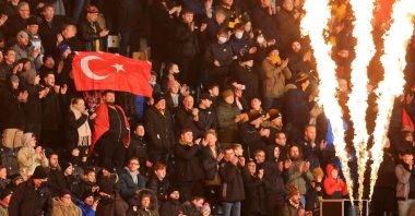A fan holds up a Turkish flag in the crowd ahead of the English FA Cup third round football match between Hull City and Everton at the MKM Stadium in Kingston upon Hull, northeast England, Jan. 8, 2022. (AFP File Photo)