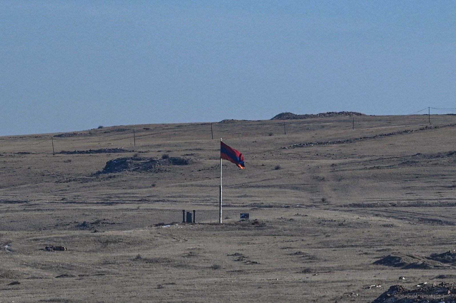 A photo taken from the ancient city of Ani in Kars shows an Armenian national flag on the Armenian side, near the Turkish-Armenian border, Jan. 7, 2022 (AFP Photo)