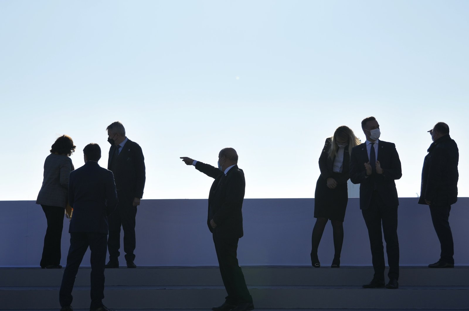 French Foreign Minister Jean-Yves Le Drian, center, gestures as he arrives for a group photo of European Union foreign ministers in Brest, France, Jan. 14, 2022. (AP Photo)