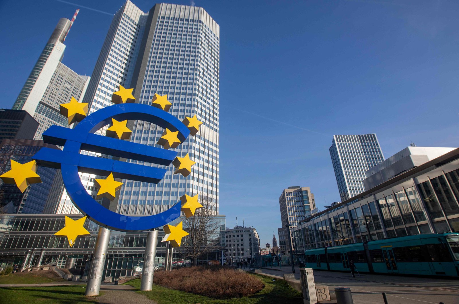 A sculpture depicting the euro currency symbol by German artist Ottmar Hِrl is seen in front of the former European Central Bank (ECB) headquarters building in Frankfurt am Main, western Germany, on Dec. 22, 2021. (AFP Photo)
