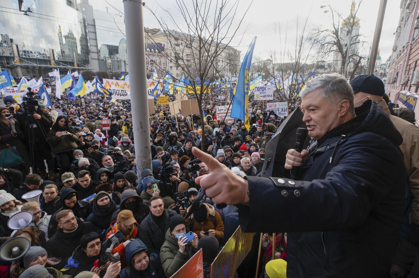 Former Ukrainian President Petro Poroshenko, (R), speaks to a crowd in front of a court building prior to a court session, in Kyiv, Ukraine, Jan. 19, 2022. (AP Photo)