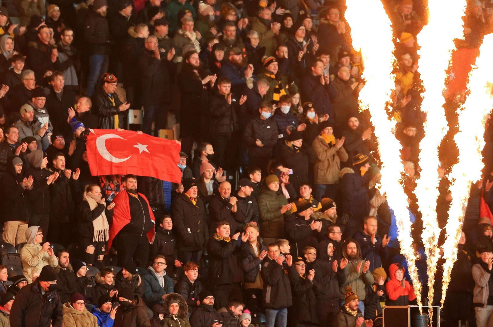 A fan holds up a Turkish flag in the crowd ahead of the English FA Cup third round football match between Hull City and Everton at the MKM Stadium in Kingston upon Hull, northeast England, Jan. 8, 2022. (AFP File Photo)