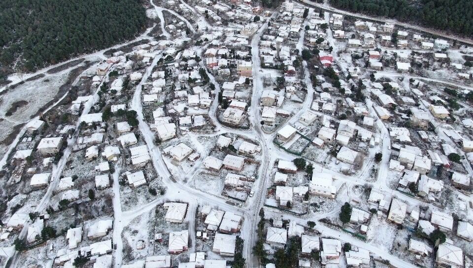 An aerial view of snow-covered buildings in the Kartal district, in Istanbul, Turkey, Jan. 19, 2022. (İHA PHOTO) 