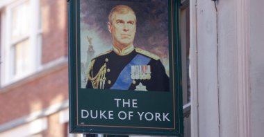 A portrait of Britain's Prince Andrew is seen on a sign outside the Duke of York public house in London, Britain, Jan. 14, 2022. (Reuters Photo)