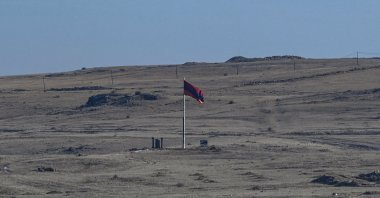 A photo shows an Armenian national flag on the Armenian side, near the Turkish-Armenian border at the  ancient city of Ani in Kars, Jan. 7, 2022. (AFP Photo)