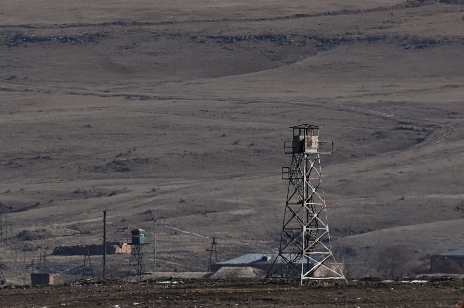 A photo taken on January 7, 2022 shows Armenian border guard towers near the Turkish-Armenian border in the ancient city of Ani in Kars. (Photo by Ozan KOSE / AFP)