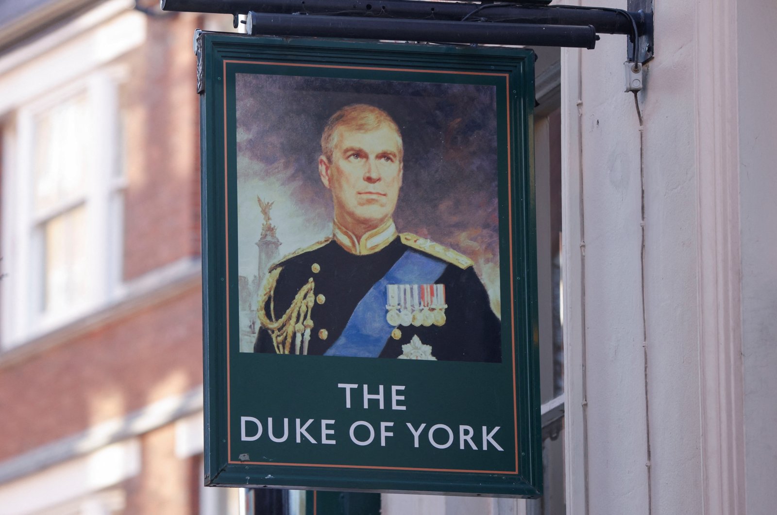 A portrait of Britain&#039;s Prince Andrew is seen on a sign outside the Duke of York public house in London, Britain, Jan. 14, 2022. (Reuters Photo)