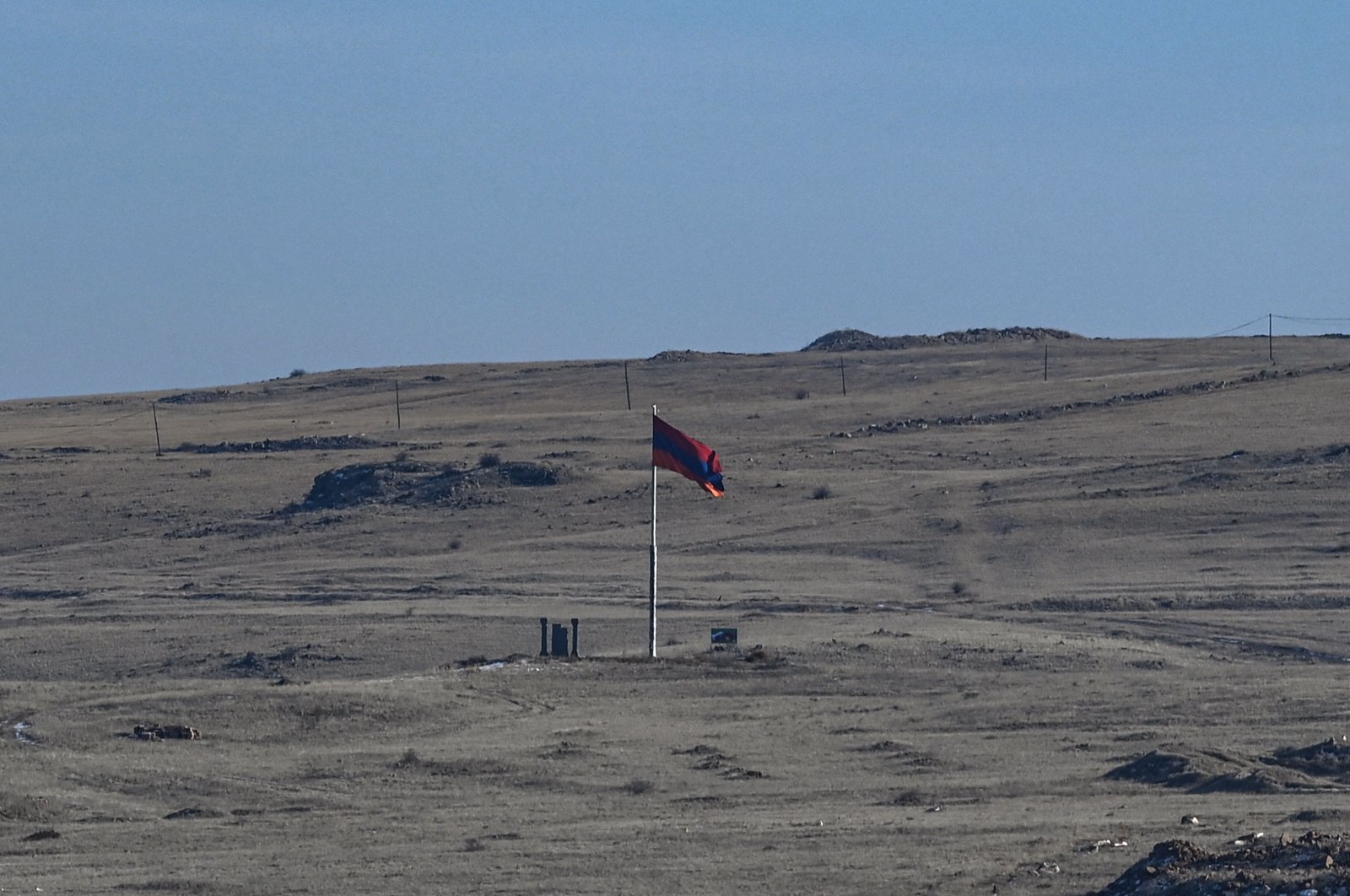 A photo shows an Armenian national flag on the Armenian side, near the Turkish-Armenian border at the  ancient city of Ani in Kars, Jan. 7, 2022. (AFP Photo)
