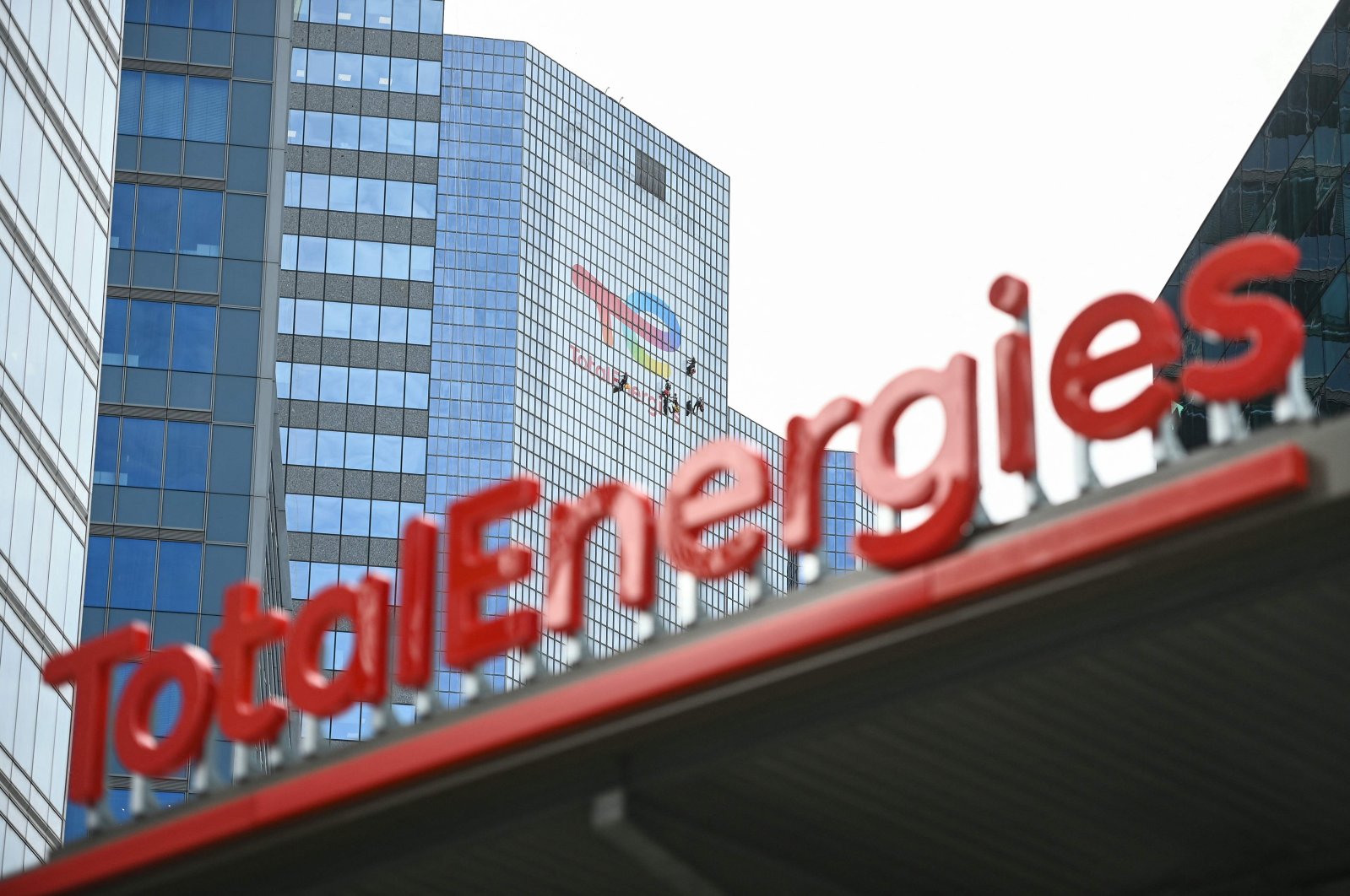 The new TotalEnergies logo is seen during its unveling ceremony, at a charging station in La Defense on the outskirts of Paris, France, May 28, 2021. (AFP Photo)