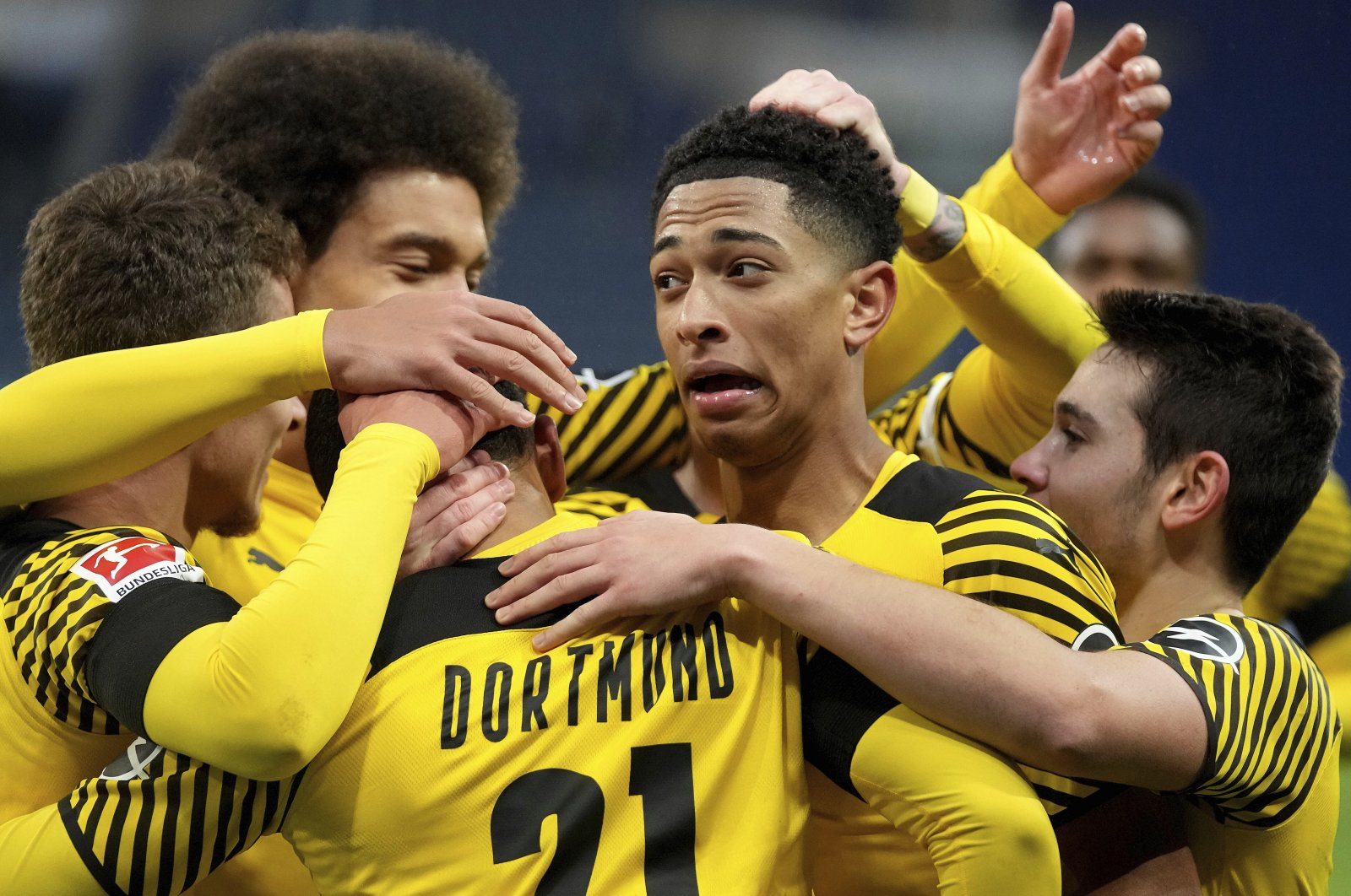 Dortmund players celebrate after scoring their side&#039;s third goal during a German Bundesliga soccer match between TSG 1899 Hoffenheim and Borussia Dortmund in Sinsheim, Germany, Jan. 22, 2022. (AP Photo)
