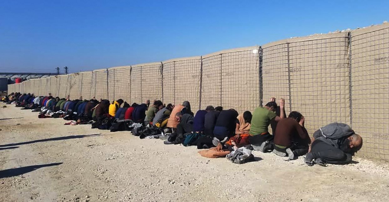 Daesh terrorists are held after being captured by YPG terrorists after they attacked Gweiran Prison, in Hassakeh, northeast Syria, Jan. 21, 2022. (AP Photo)
