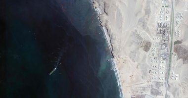 This handout satellite image released by Maxar Technologies shows an overview of Repsol oil refinery and offshore pipeline in Ventanilla, Peru, Jan. 19, 2022. (Photo by Satellite image 2022 Maxar Technologies/AFP )