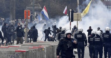 Police confront protestors during a demonstration against COVID-19 measures in Brussels, Belgium, Jan. 23, 2022. (AP Photo)