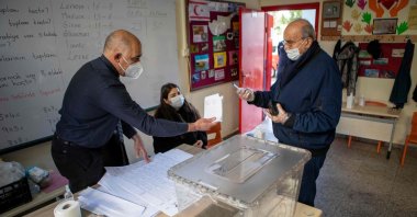 A Turkish Cypriot arrives to cast his ballot at a polling station in Lefkoşa, Turkish Republic of Northern Cyprus, Jan. 23, 2022. (AFP Photo)