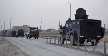 YPG terrorists patrol a street in the northern city of Hassakeh, Syria, on Jan. 23, 2022. (AFP Photo)