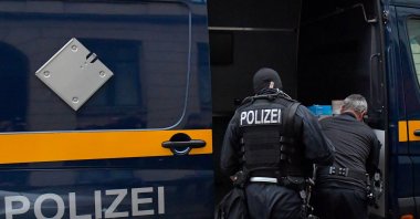 Police in front of a vehicle during raids in several locations in Dresden, Germany, Dec.15, 2021. (Reuters File Photo)