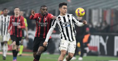 Juventus&#039; Paulo Dybala vies with AC Milan&#039;s Pierre Kalulu in a Serie A match, Milan, Italy, Jan. 23, 2022. (AA Photo)