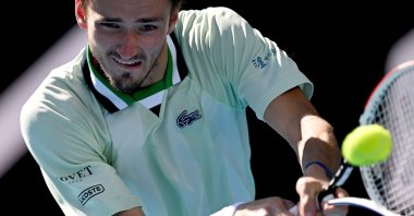 Russia's Daniil Medvedev hits a return against Maxime Cressy during their Australian Open match, Melbourne, Australia, Jan. 24, 2022. (AFP Photo)