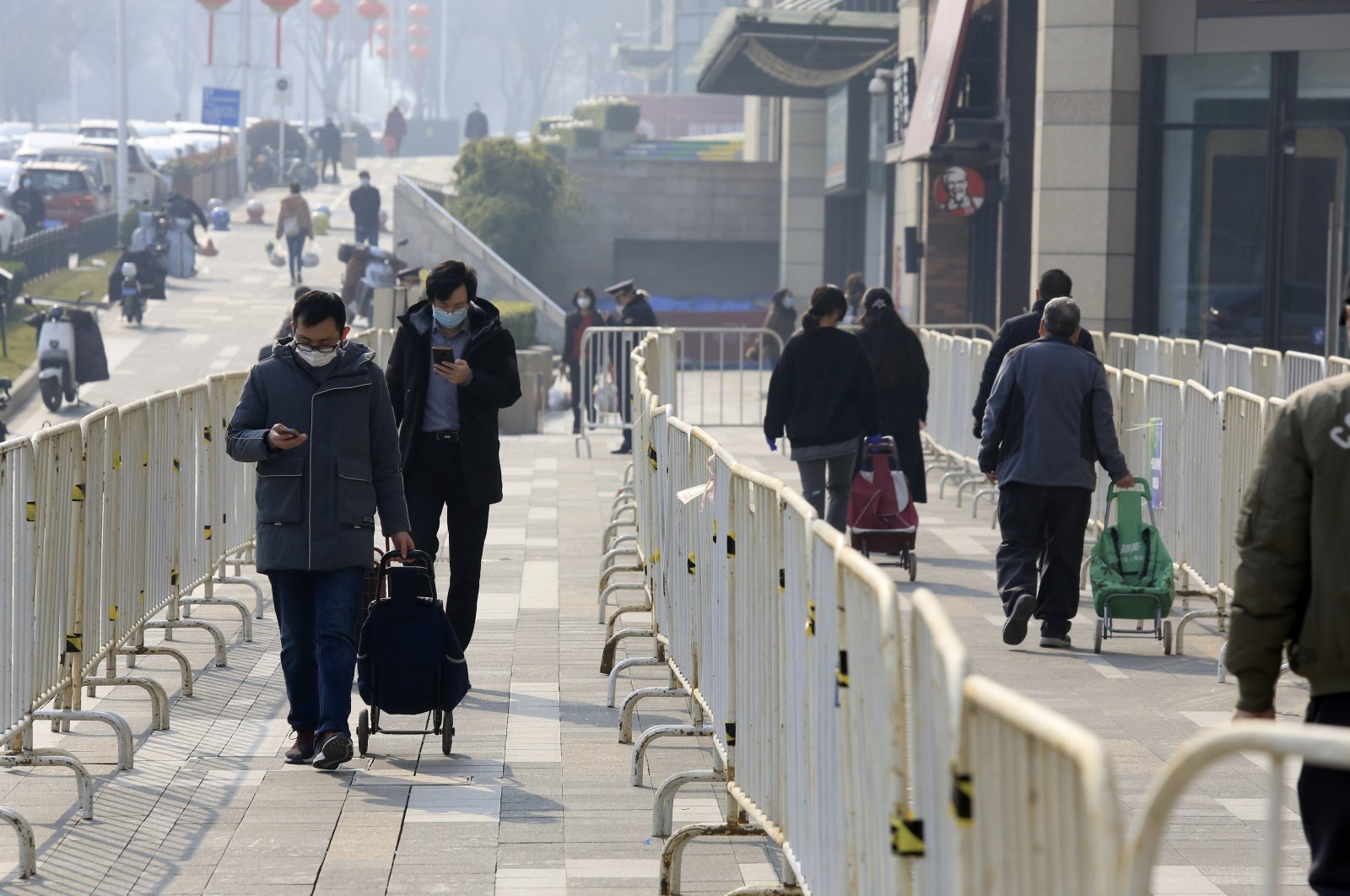 Shoppers with permits walk to a supermarket in Xi&#039;an in northwestern China&#039;s Shaanxi Province, Jan. 17, 2022. (AP Photo)
