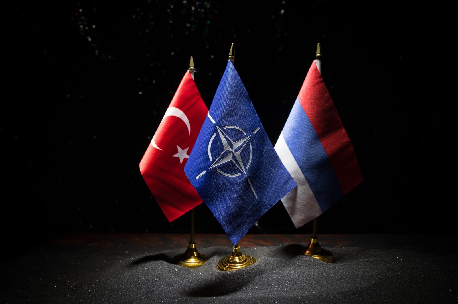The flags of Turkey, NATO and Russia, Baku, Azerbaijan, March 3, 2020. (Photo by Shutterstock)