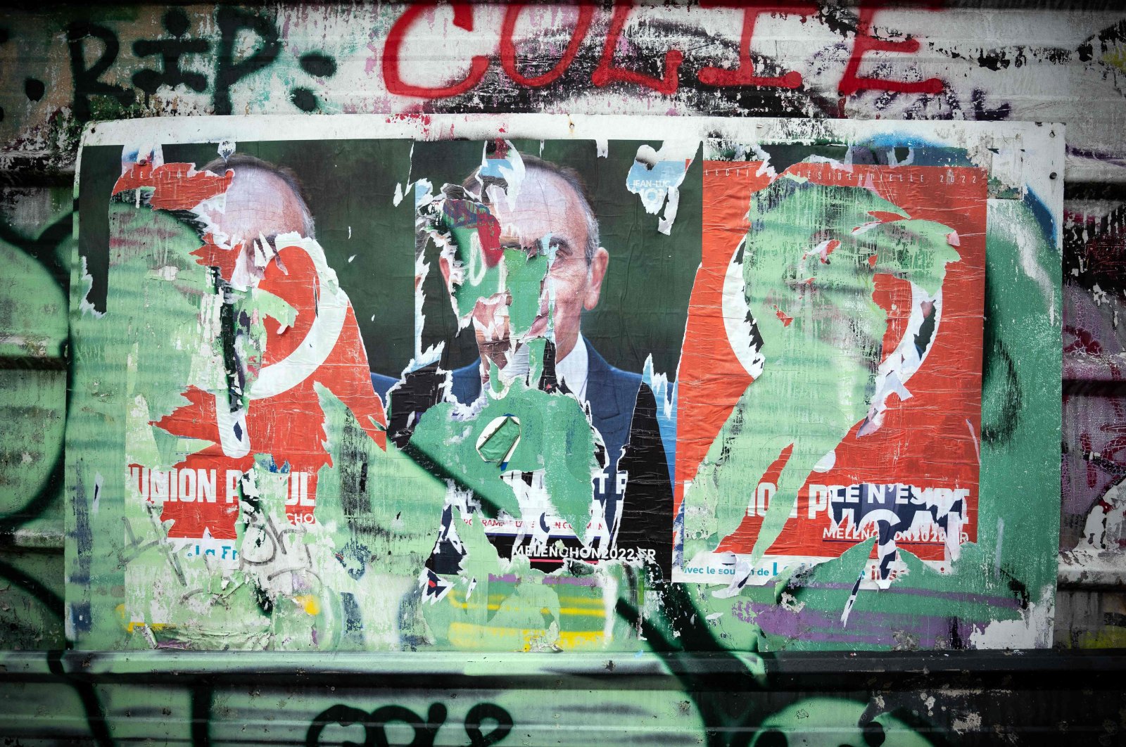 A photograph shows a ripped campaign poster depicting Eric Zemmour, in Toulouse, southern France, Jan. 20, 2022. (AFP Photo)