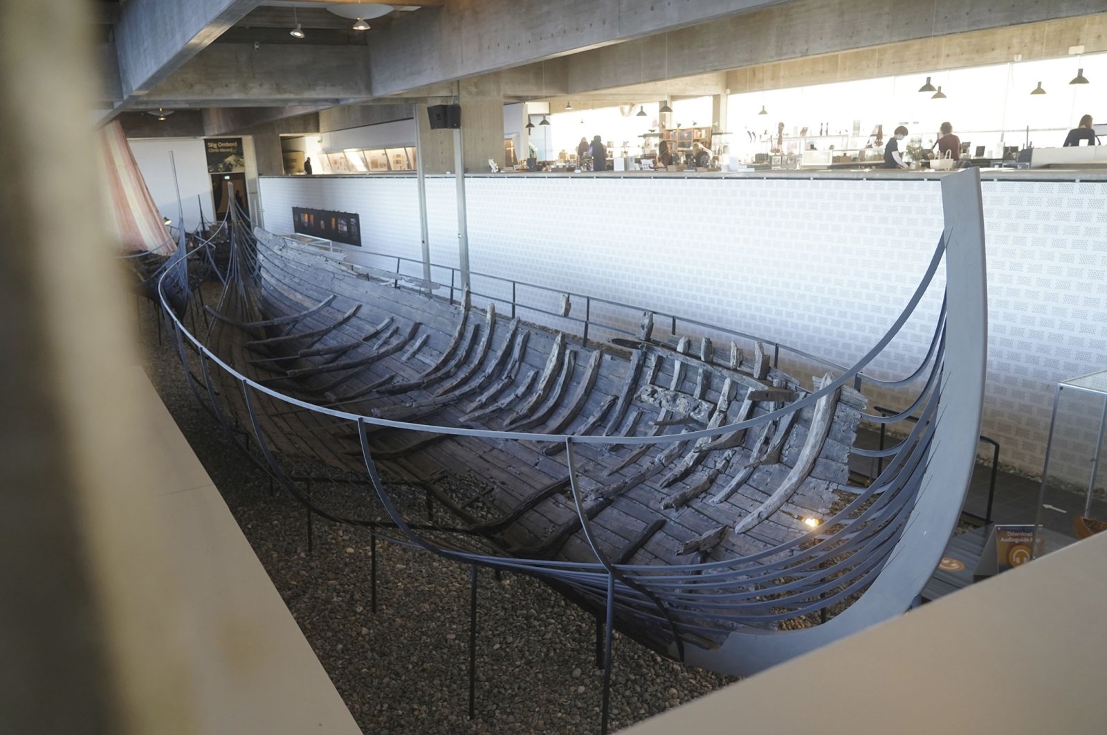 An 11th century, 15-meter (49-foot) Viking sea-faring trading vessel, built in the Nordic clinker boat tradition, sits on display at the Viking Ship Museum in Roskilde, Denmark, Jan. 17, 2022. (AP Photo)