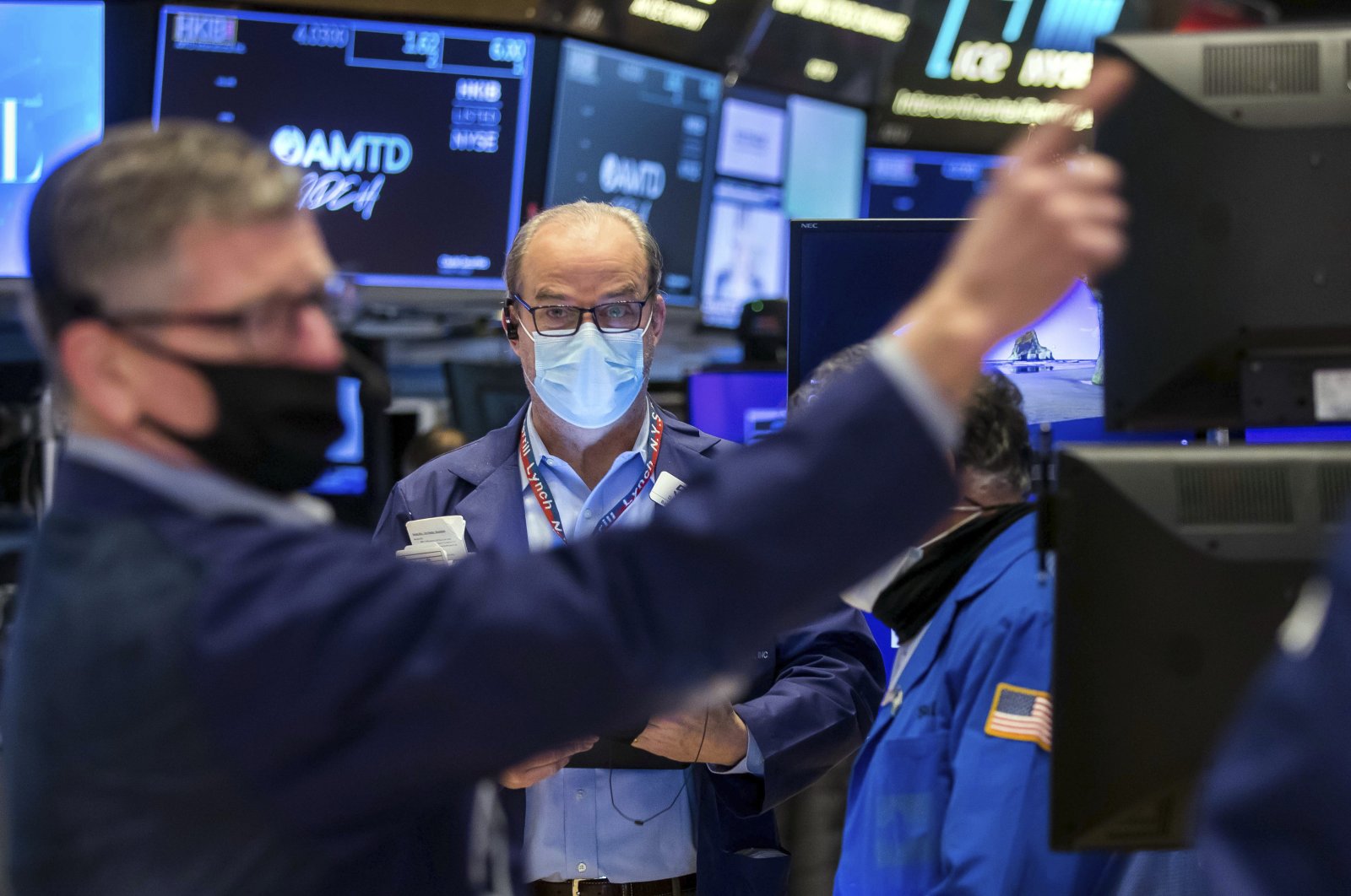 In this photo provided by the New York Stock Exchange, trader David O&#039;Day (C) works on the floor, Jan. 20, 2022. (AP Photo)