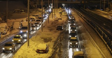 A view of traffic flowing next to abandoned cars in Istanbul's Haramidere quarter, Turkey, Jan. 25, 2022. (AA PHOTO)