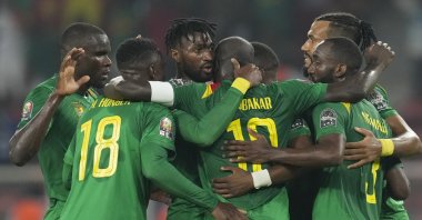 Cameroon's Karl Toko-Ekambi (C) celebrates with teammates after scoring in an AFCON match against Comoros, Yaounde, Cameroon, Jan. 24, 2022. (AP Photo)