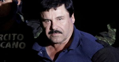 Recaptured drug lord Joaquin &amp;quot;El Chapo&amp;quot; Guzman is escorted by soldiers at the hangar belonging to the office of the Attorney General in Mexico City, Mexico, Jan. 8, 2016. (Reuters Photo)