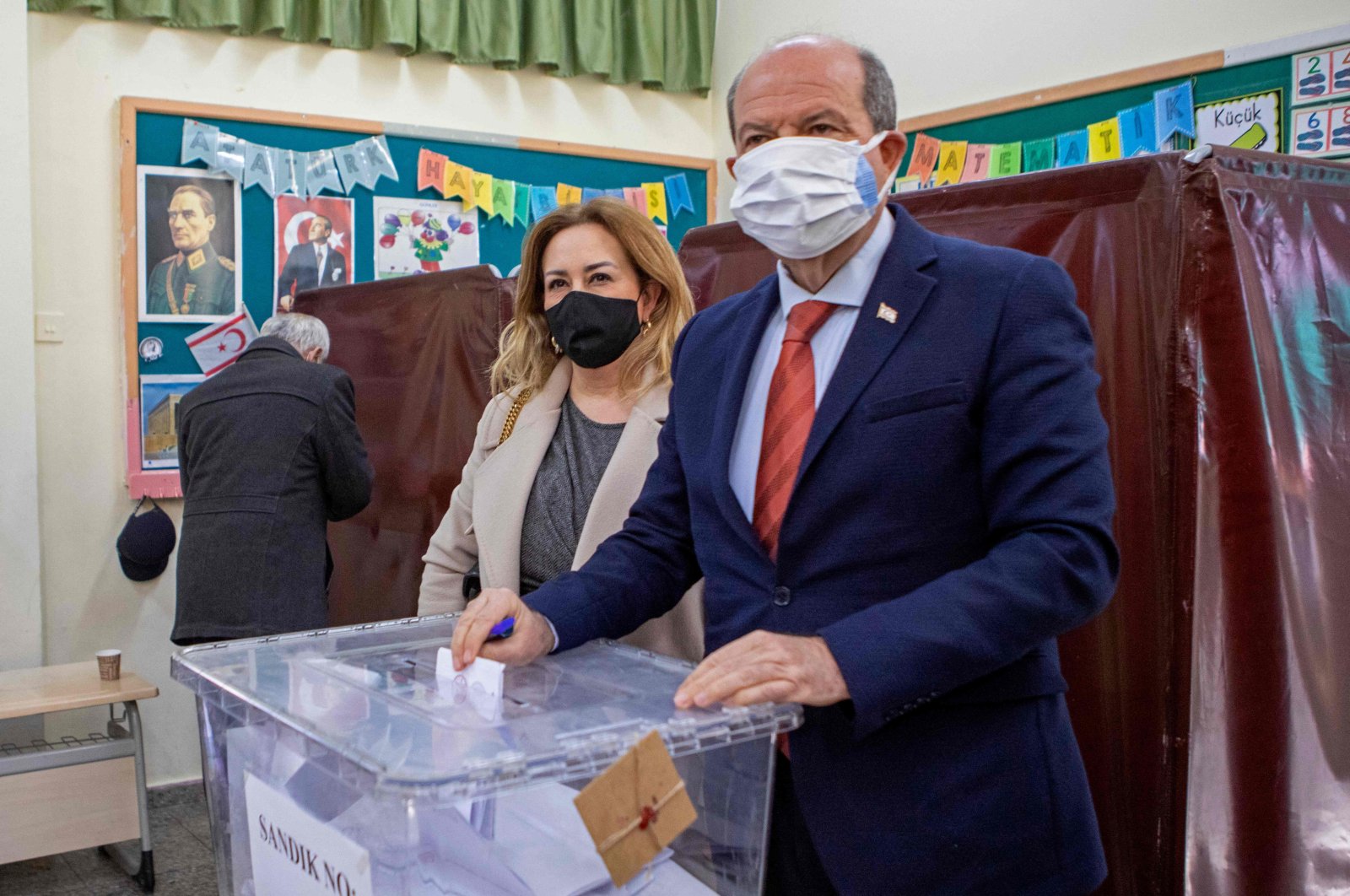 President Ersin Tatar alongside his wife casts his ballot at a polling station in the capital Lefkoşa (Nicosia), TRNC, Jan. 23, 2022. (AFP Photo)