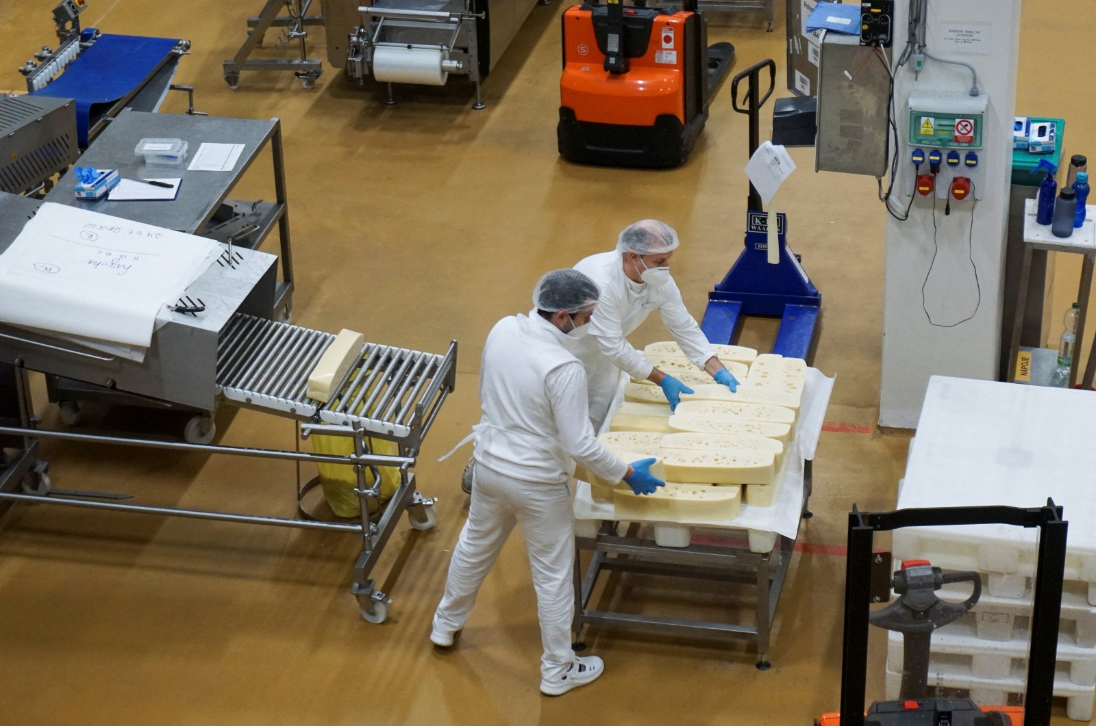 Employees work at Madeta dairy factory in the town of Plana nad Luznici, Czech Republic, Jan. 24, 2022. (Reuters Photo)