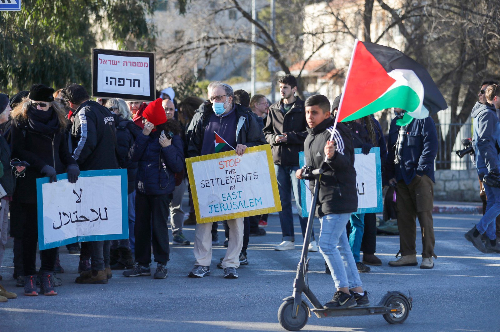 Palestinian, Israeli and foreign activists protest in the East Jerusalem neighborhood Sheikh Jarrah, occupied Palestine, Jan. 21, 2022. (AFP Photo)