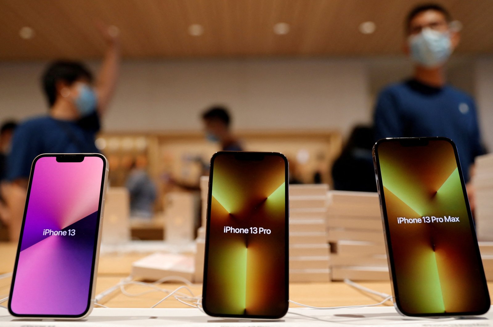 Apple&#039;s iPhone 13 models are pictured at an Apple Store on the day the new Apple iPhone 13 series goes on sale, in Beijing, China, Sept. 24, 2021. (Reuters File Photo)