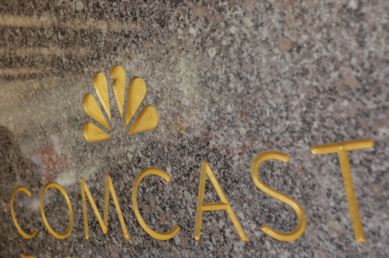 The NBC and Comcast logos are displayed on 30 Rockefeller Plaza in midtown Manhattan in New York, U.S., Feb. 27, 2018. (Reuters Photo)