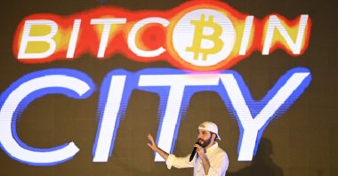 El Salvador&#039;s President Nayib Bukele gestures during his speech at the closing ceremony of the Latin Bitcoin conference (LaBitConf) at Mizata Beach, El Salvador, Nov. 20, 2021. (AFP Photo)