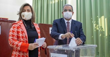 Prime Minister Faiz Sucuoğlu alongside his wife casts his ballot at a polling station in the capital Lefkoşa (Nicosia), TRNC, Jan. 23, 2022. (AFP Photo)