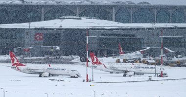 Aircraft are parked on the tarmac of Istanbul Airport, Turkey, Jan. 25, 2022. (AFP PHOTO)