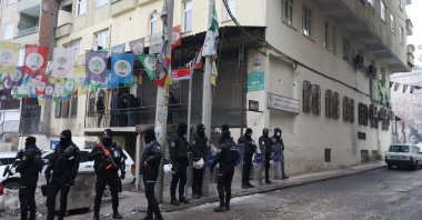 Police officers are seen in front of the DBP office in Diyarbakır, Turkey, Jan. 26, 2022. (AA Photo)
