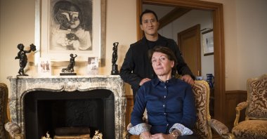 Marina Picasso, granddaughter of artist Pablo Picasso, sits and poses for a photo with her son Florian Picasso during an interview in Cologny near in Geneva, Switzerland, Jan. 25, 2022. (AP Photo)