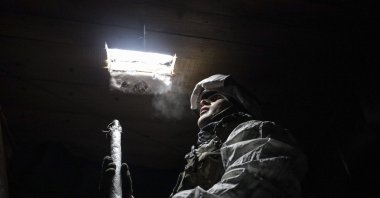 A Ukrainian officer inspects the situation on a front line near the village of Avdiivka, Ukraine, Jan. 25, 2022. (EPA Photo) 