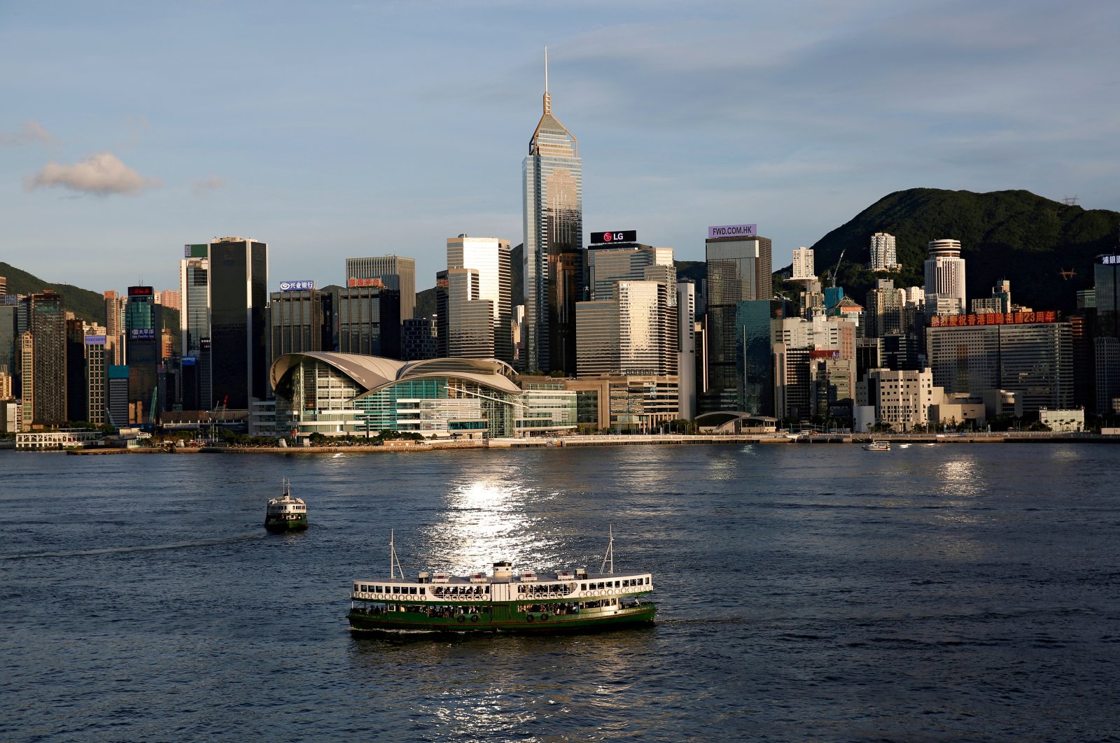A Star Ferry boat crosses Victoria Harbor in front of a skyline of buildings in Hong Kong, China, June 29, 2020. (Reuters Photo)