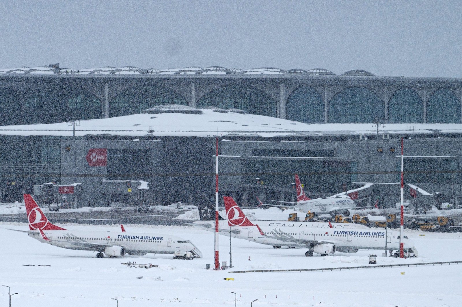 Aircraft are parked on the tarmac of Istanbul Airport, Turkey, Jan. 25, 2022. (AFP PHOTO)