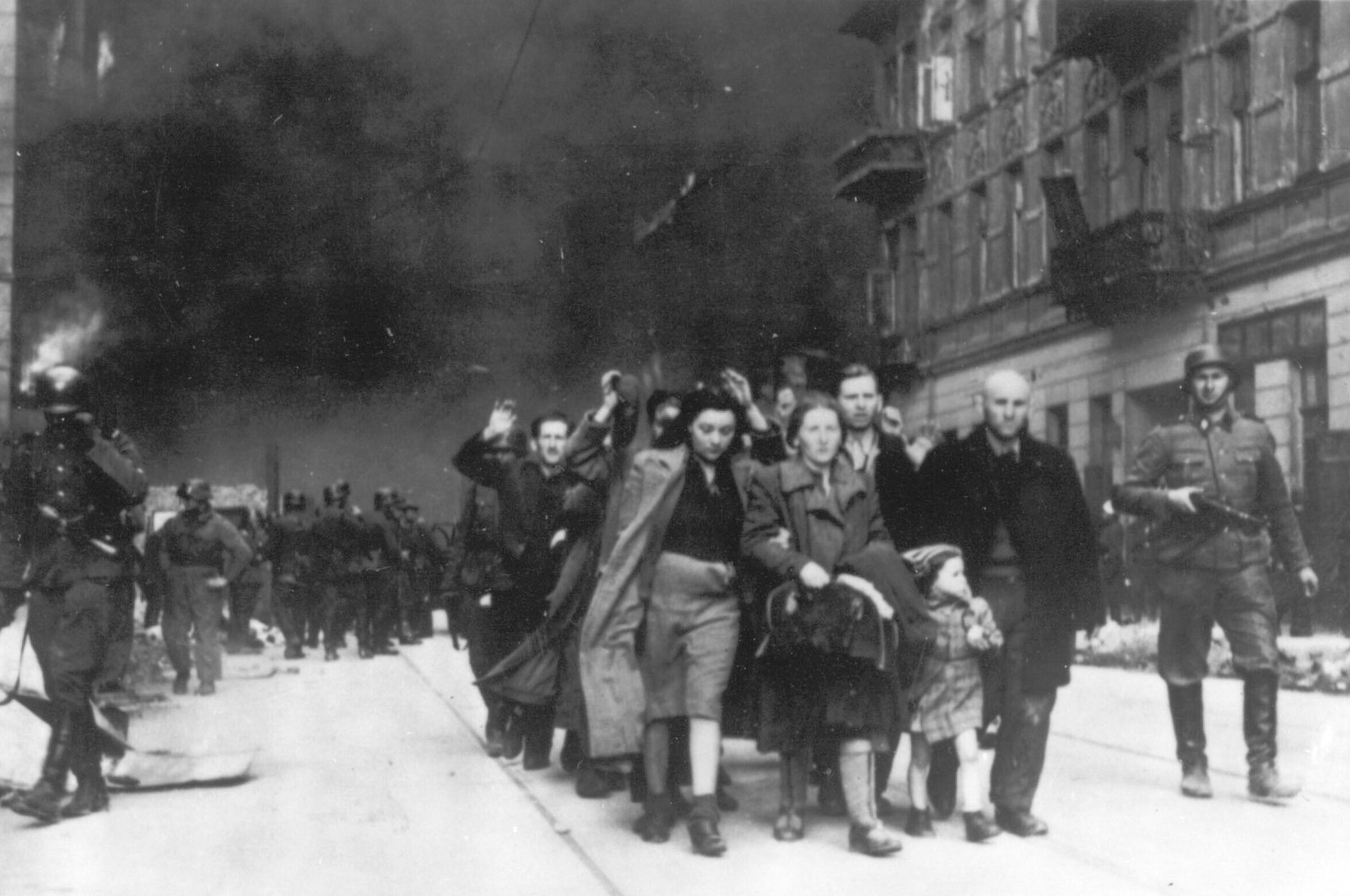 A group of Polish Jews are led away for deportation by German SS soldiers during the destruction of the Warsaw Ghetto by German troops, April 19, 1943. (AP Photo)